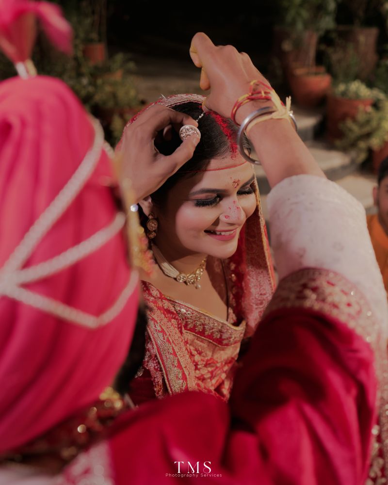 Detailed shot of bridal jewellery and mehendi – editorial photography